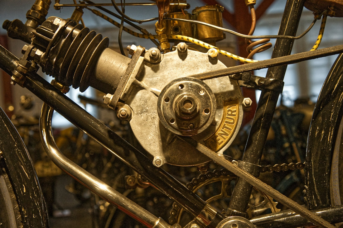 An old motorcycle engine and its components.